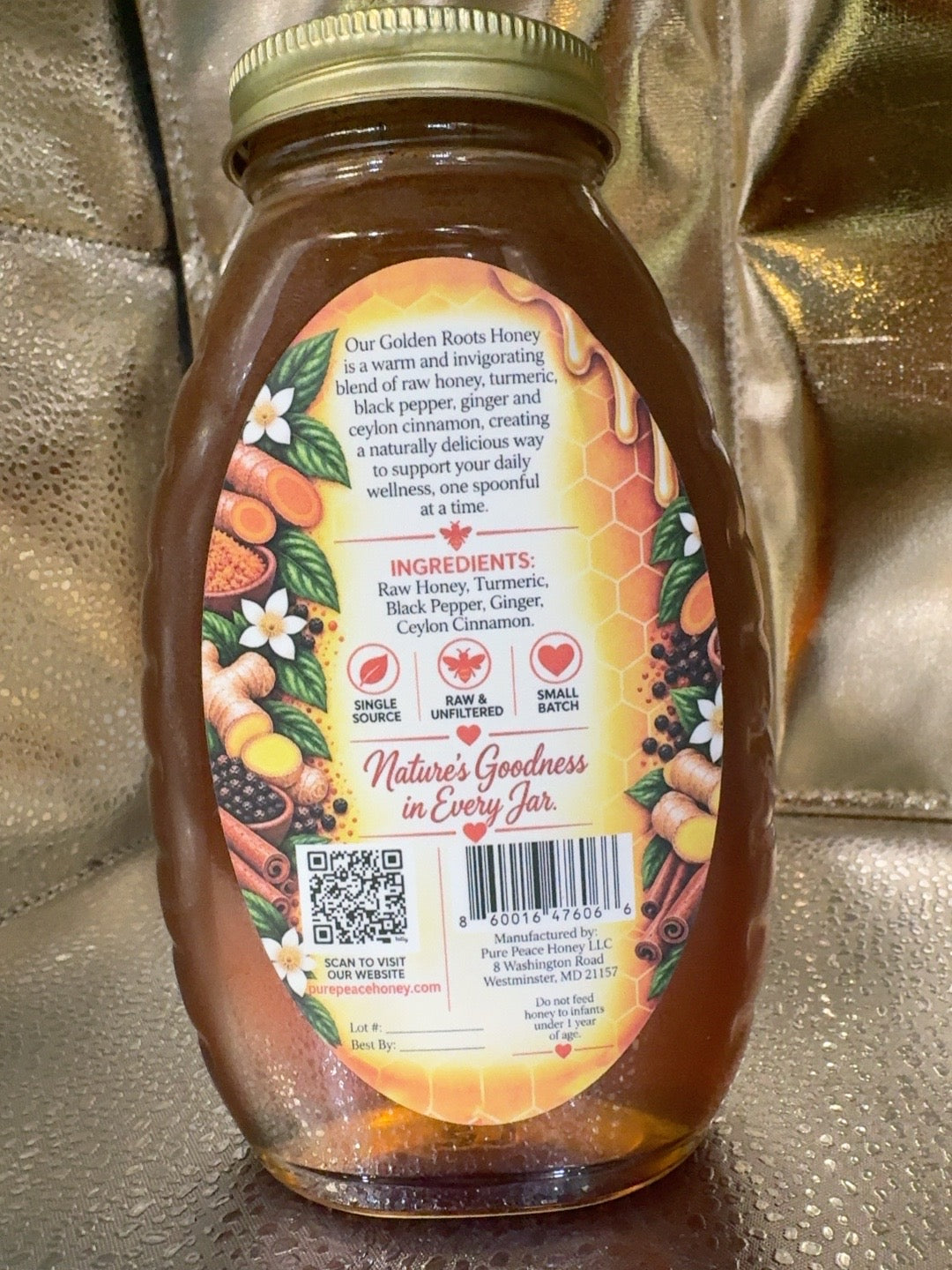 Back label of Pure Peace Golden Roots Honey showing ingredients: raw honey, turmeric, black pepper, ginger, Ceylon cinnamon